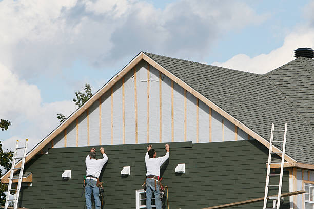 Professional Siding technician working in Peachland, NC